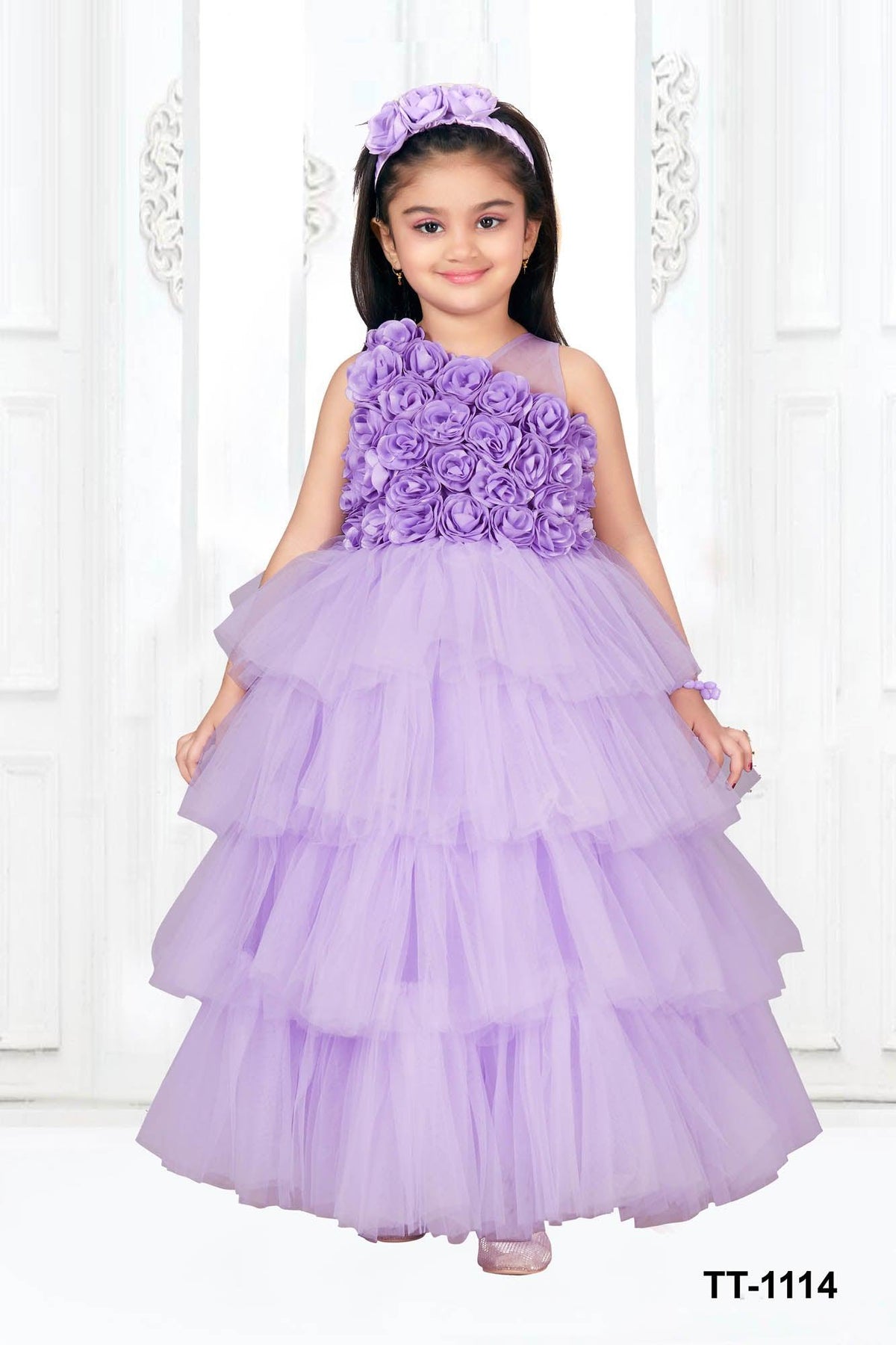 Lavender multilayered frilled gown with rose surface embellishment. - Lagorii Kids