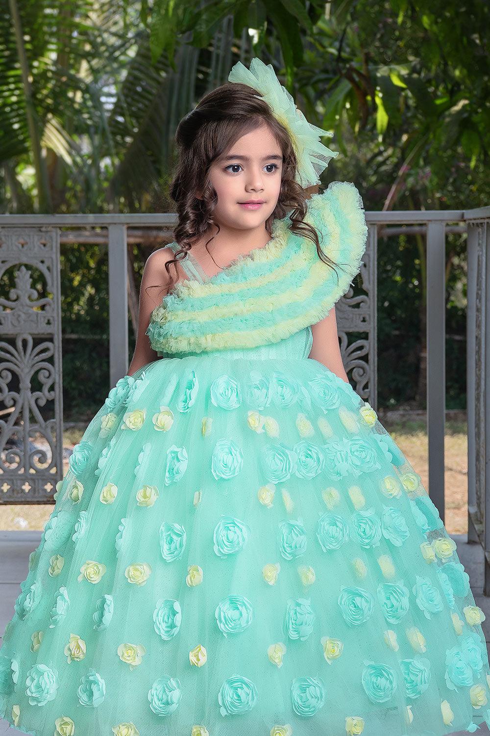 mint green princess gown with frilled neckline and floral embellishments lagorii kids 2